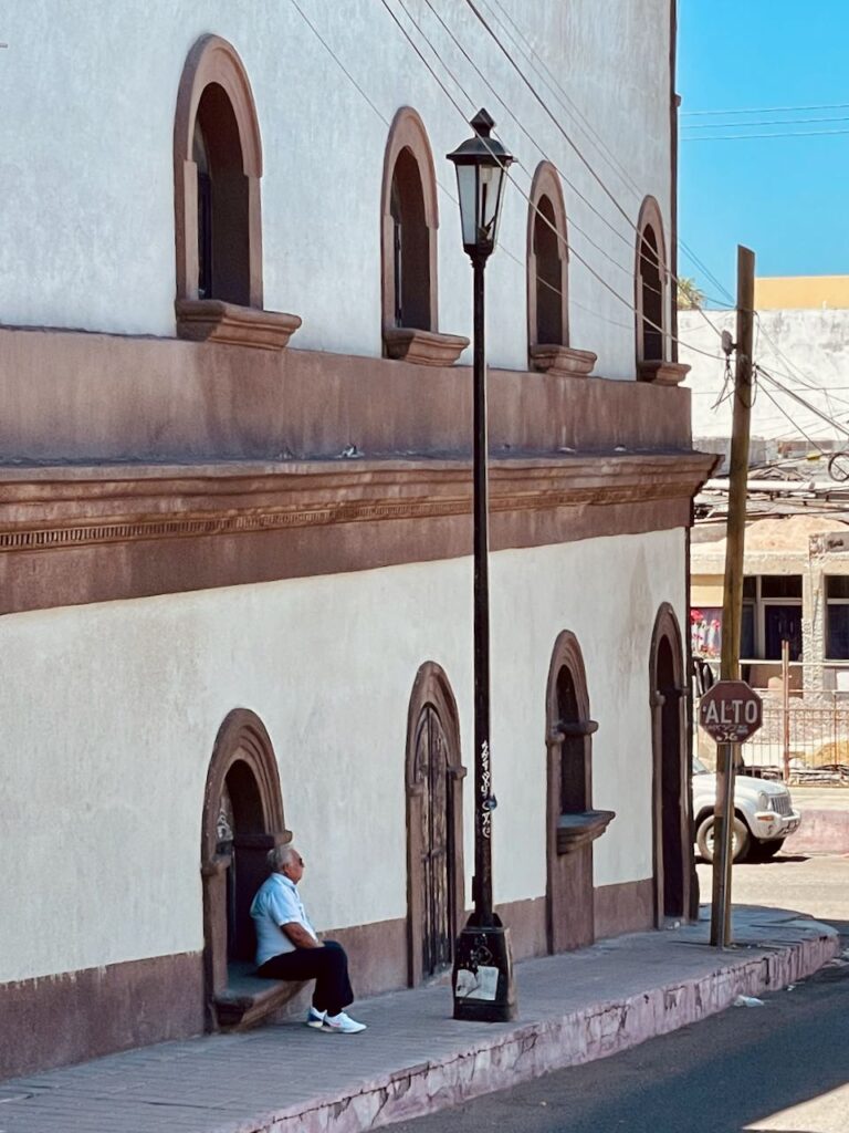 Man Sitting on a Window Sill, La Paz Mexico