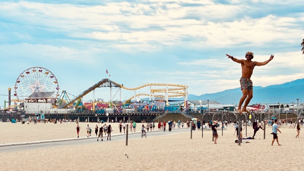 Slack line walker and pier Santa Monica