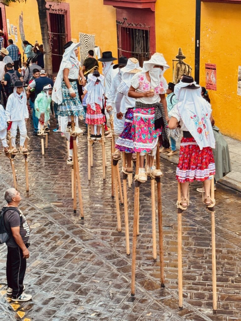 Stilt walkers Day of the Dead parade Oaxaca City